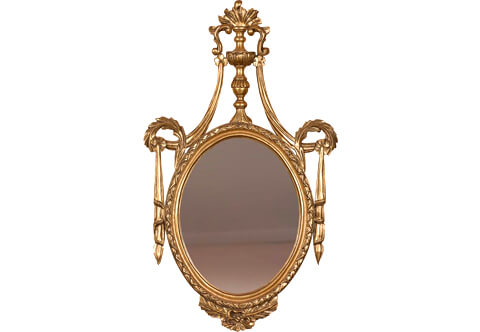 A sensational Italian Neoclassical 19th century style giltwood oval mirror, carved and gilded with French gold foils and patinated, The mirror plate within a moulded beaded ribboned frame terminating with leafy works and surmounted with a baluster shaped torch with flame with S shape scrolled leaves extended with long turned acanthus leaves connected with exquisite drapery pendants